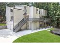Stylish two-story home with a modern exterior, deck, and well-maintained landscaping at 95 Lakeshore Ne Cir, Marietta, GA 30067