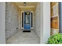 Inviting entryway with blue door, brick walls, and white trim, creating a warm welcome at 112 Calder Dr, Alpharetta, GA 30009