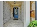 Close-up of a blue front door framed by brick and white pillars at 112 Calder Dr, Alpharetta, GA 30009