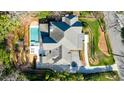 Aerial view of a home with a private pool, patio, and well-maintained landscaping at 479 Argonne Nw Dr, Atlanta, GA 30305