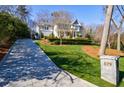 Long driveway leading up to a well-manicured lawn and charming residence at 479 at 479 Argonne Nw Dr, Atlanta, GA 30305