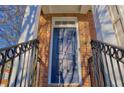 Close up of the front door with the address 401, black railings and brick facade at 401 Iona Abbey Se Ct # 6, Smyrna, GA 30082