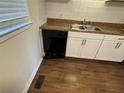Bright kitchen featuring white cabinets, modern countertops, and stainless steel sink at 2976 Nelson Dr, Duluth, GA 30096