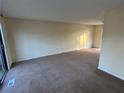 Spacious living room with wall-to-wall carpeting and a sliding glass door at 2976 Nelson Dr, Duluth, GA 30096