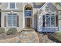 Inviting front entrance with stone pathway and architectural details at 4260 River Club Dr, Cumming, GA 30041