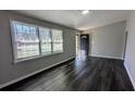 Bright living room with hardwood floors and large windows offering plenty of natural light at 4214 Canby Ln, Decatur, GA 30035