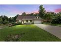 Beautiful house with manicured lawn, covered porch, and warm evening light creating a welcoming ambiance at 144 Bobs Sw Dr, Mableton, GA 30126