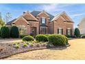 Brick two-story home with manicured landscaping and traditional architectural details at 359 Flatstone Sw Way, Marietta, GA 30064