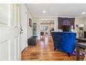 Inviting living room with hardwood floors, stylish blue armchair, and an open layout at 2114 Fellowship Rd, Tucker, GA 30084