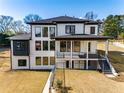 Modern home with a walkout basement and expansive back deck perfect for entertaining guests at 2551 Kilgore Rd, Buford, GA 30519