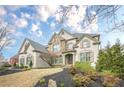 Charming two-story home featuring a stone facade and well-maintained landscaping at 5825 Laurel Oak Dr, Suwanee, GA 30024