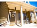 Charming front door with wreath, sidelights and stacked stone accents at 95 Gorham Gates Dr, Hiram, GA 30141