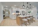 Bright kitchen with an island, pendant lighting, stainless steel appliances, and modern bar stools at 109 Priestwood Ln, Acworth, GA 30102