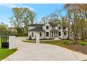 Stunning two-story home with a private driveway, painted brick, and well-manicured landscaping at 3968 Ashford Dunwoody, Brookhaven, GA 30319