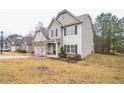 Charming two-story home featuring a well-manicured lawn, traditional siding, and an inviting front entrance at 2534 Grayton Loop, Villa Rica, GA 30180