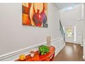 Elegant foyer featuring hardwood floors, console table, and stylish decor at 2167 Dodson Woods Dr, Fairburn, GA 30213