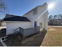 A home featuring a back deck and fenced yard at 5180 Oaktree Trl, Lithonia, GA 30038