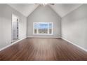 Bright bedroom with large bay window offering scenic views and hardwood flooring at 448 Buckingham Dr, Marietta, GA 30066