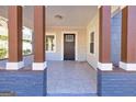 Inviting covered front porch with classic columns and a tiled floor offers a cozy outdoor space at 2506 Maple St, East Point, GA 30344