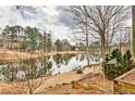 Scenic backyard with a tranquil lake view, perfect for relaxation and enjoying nature at 573 Ripplewater Sw Dr, Marietta, GA 30064