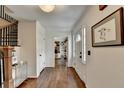 Hardwood flooring flows throughout this entryway with views to a light filled living space at 1643 North Springs Dr, Dunwoody, GA 30338