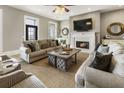 Cozy living room featuring a fireplace, neutral paint, and a comfortable seating arrangement at 5821 Clarion St # J8, Cumming, GA 30040