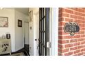 Charming foyer view showing the front door, address and a glimpse of the home's interior at 2674 Misty Rock Cv, Dacula, GA 30019