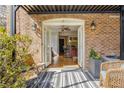 Inviting outdoor patio with furniture and view into the living and kitchen area at 1261 Lavista Ne Rd # E9, Atlanta, GA 30324