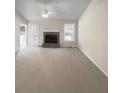 Spacious living room with vaulted ceiling, fireplace, neutral tones, and ample natural light at 5281 Brookshire Ct, Douglasville, GA 30135