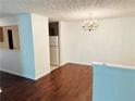 Dining room features hardwood floors and a decorative chandelier fixture at 2204 Waldrop Pl, Decatur, GA 30034