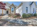 Inviting walkway leading to the entrance, showcasing the exterior architectural details and landscaping at 3619 Elinburg Ne Ct, Buford, GA 30519