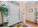 Bright entryway featuring a white front door, hardwood floors, and decorative accents at 2692 Glenrose Hl, Atlanta, GA 30341
