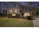 Charming split-level home featuring a well-maintained front yard and driveway at 1736 Inas Way, Tucker, GA 30084