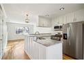 Beautifully updated kitchen featuring stainless steel appliances and granite countertops at 2232 Dunseath Nw Ave # 303, Atlanta, GA 30318