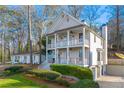 Rear view of charming two-story home with a three-car garage at 2580 Defoors Ferry Nw Rd, Atlanta, GA 30318