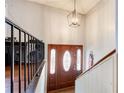 Inviting foyer with a chandelier and decorative front door at 410 Killian Hill Sw Rd, Lilburn, GA 30047