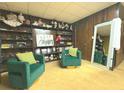 Cozy living room featuring vintage decor, including a display shelf with dolls, and wood-paneled walls at 4227 Cheryl Ann Court Ct, Stone Mountain, GA 30083