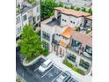 Beautiful aerial view of modern townhouses with rooftop terraces and convenient parking at 1199 Huff Rd # 121, Atlanta, GA 30318