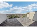 Large rooftop terrace with wood-like flooring and expansive neighborhood views at 1199 Huff Rd # 121, Atlanta, GA 30318