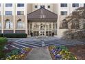 Front entrance of high-rise building with awning and beautiful colorful flowers at 2479 Peachtree Ne Rd # 912, Atlanta, GA 30305