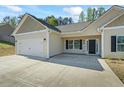Charming single-story home with a two-car garage and a well-manicured lawn at 127 Cranbrooke Dr, Dallas, GA 30157