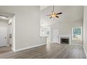 Spacious living room featuring high ceilings, a fireplace, and modern flooring at 127 Cranbrooke Dr, Dallas, GA 30157