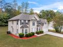 Attractive two-story home with a well-maintained lawn and two-car garage at 3529 Riverview Approach, Ellenwood, GA 30294