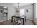 Bright dining room with modern light fixture and stylish decor with easy access to kitchen at 1251 Richland Sw Rd, Atlanta, GA 30310