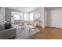 Inviting living room features hardwood floors, a modern rug, and ample natural light at 1251 Richland Sw Rd, Atlanta, GA 30310