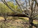 Landscaped yard and trees surrounding the home at 719 Copper Trace Way, Woodstock, GA 30189