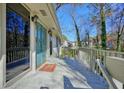 Inviting front porch with a vibrant blue door and decorative glass, offering a warm welcome at 3310 Bryan Way, Marietta, GA 30008