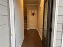 Inviting entryway with hardwood floors and a view of the staircase and interior door at 338 Cherryhill Ln, Woodstock, GA 30188