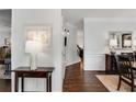 Elegant hallway featuring hardwood floors, stylish decor, and a view of the dining area at 2149 Whittier Nw Pl, Atlanta, GA 30318