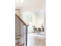 Bright dining area with large windows, hardwood floors, and modern decor, filled with natural light at 3338 Breton Ne Cir, Brookhaven, GA 30319
